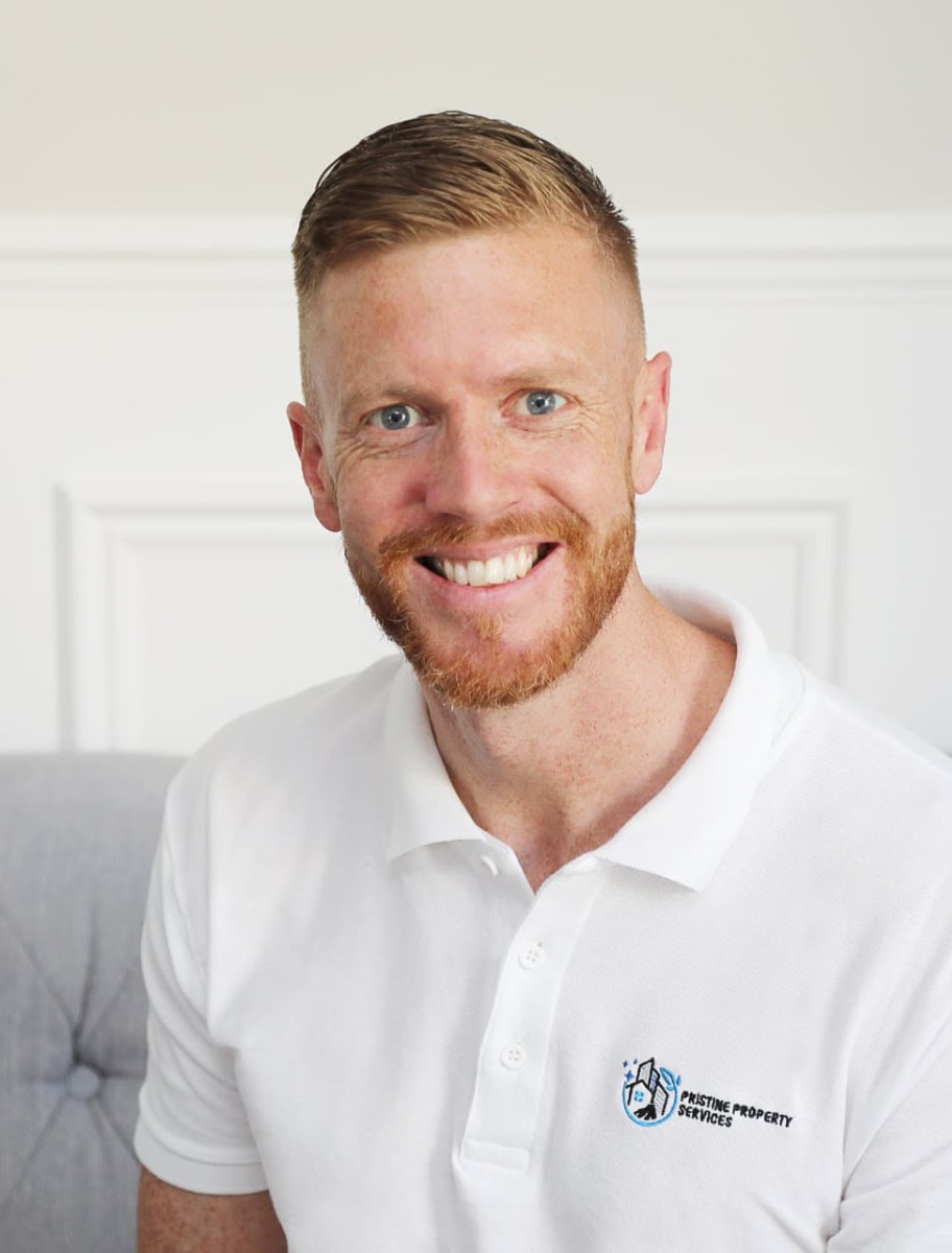 Darren Raper, owner of Pristine Property Solutions, wearing company branded workwear